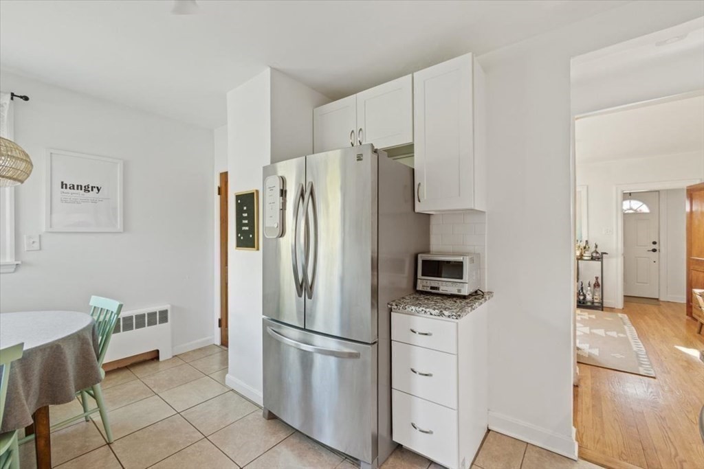 68 Congress Street Fall River, MA 02721 - Photo 18 of 38 a kitchen with stainless steel appliances a refrigerator sink and cabinets