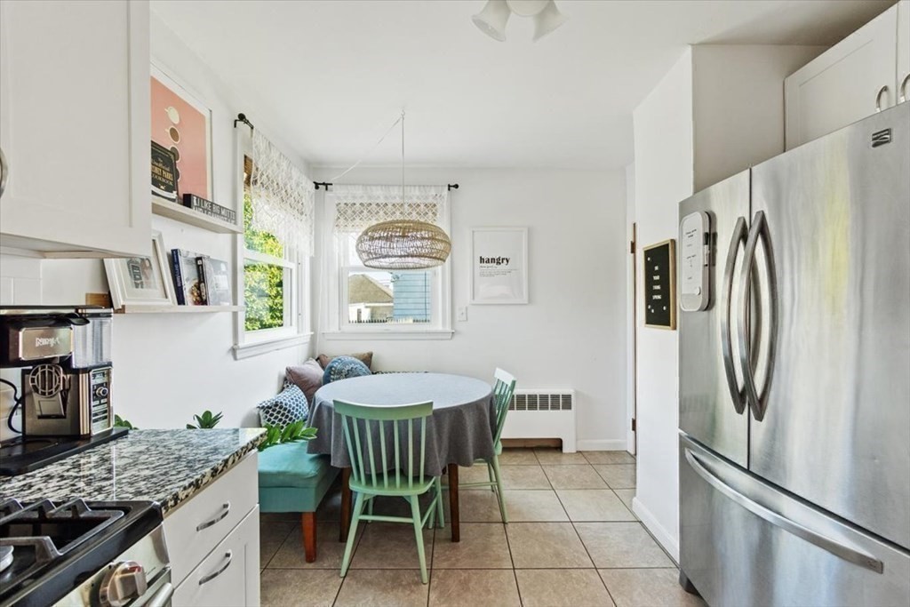 68 Congress Street Fall River, MA 02721 - Photo 19 of 38 a kitchen with stainless steel appliances granite countertop a refrigerator and a sink