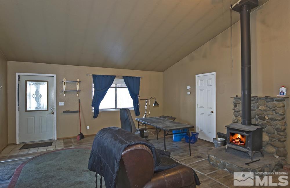 166 Pleasant Valley Road Markleeville, CA 96120 - Photo 12 of 24 a living room with furniture and a fireplace