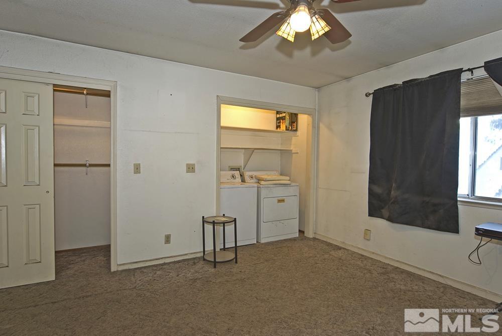 166 Pleasant Valley Road Markleeville, CA 96120 - Photo 14 of 24 wooden floor and windows in an empty room