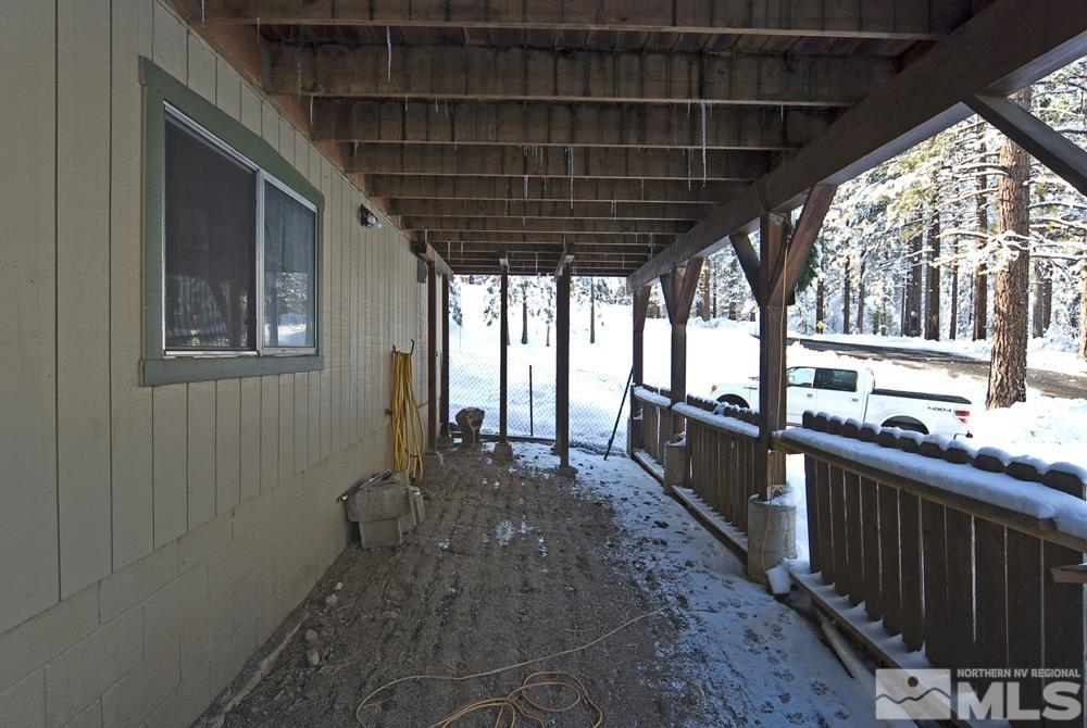 166 Pleasant Valley Road Markleeville, CA 96120 - Photo 5 of 24 a view of a porch with wooden floor and stairs