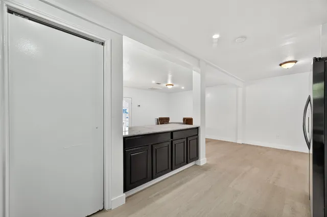 a spacious bathroom with a sink and a mirror