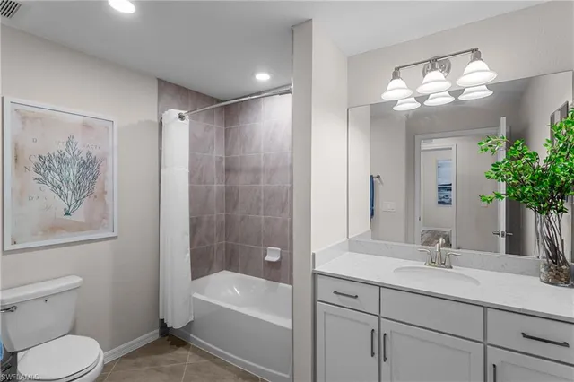 a bathroom with a toilet a sink and a bathtub