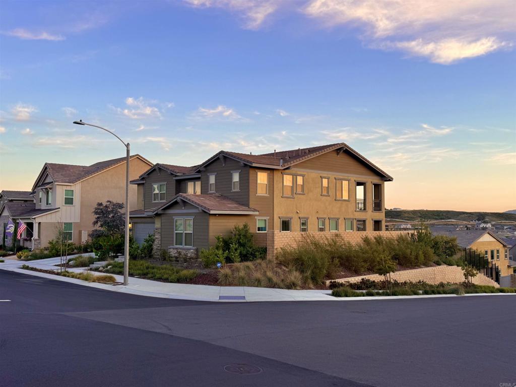 39529 Dayspring Way Temecula, CA 92591 - Photo 2 of 49 a front view of a house with a yard and garage