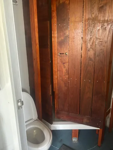 a bathroom with a toilet and shower