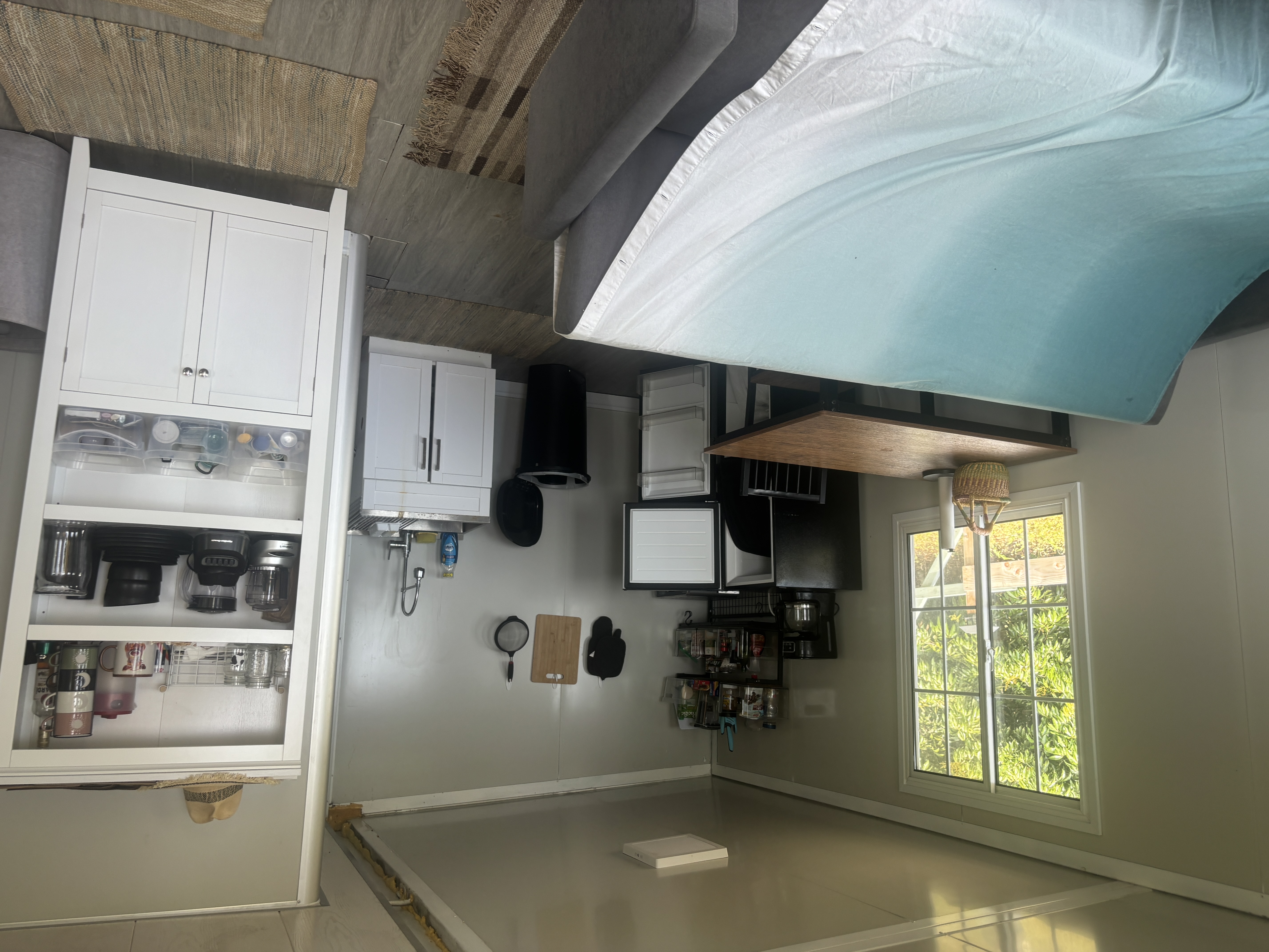 84-1226 Bruner Road Captain Cook, HI 96704 - Photo 13 of 28 a kitchen with refrigerator and window