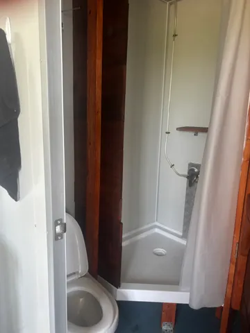 a bathroom with a tub and toilet