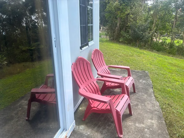 a view of a backyard with sitting area