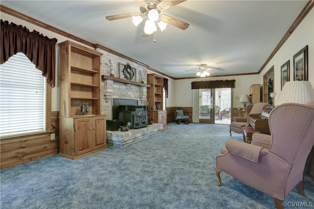 207 Rustic Drive Carson, VA 23830 - Photo 21 of 49 a living room with furniture a fireplace and a flat screen tv