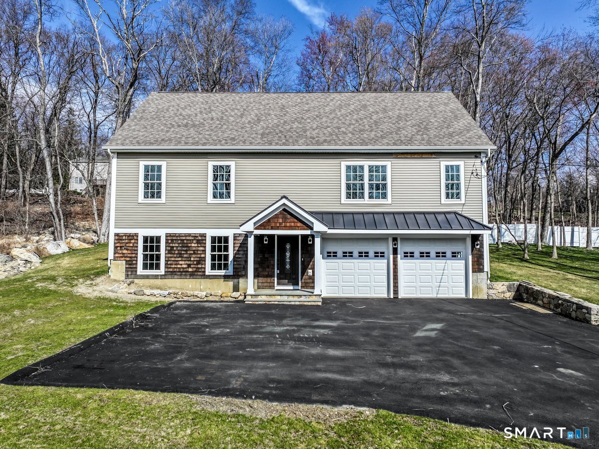 53 Pembroke Road Danbury, CT 06811 - Photo 2 of 37 a front view of a house with a yard