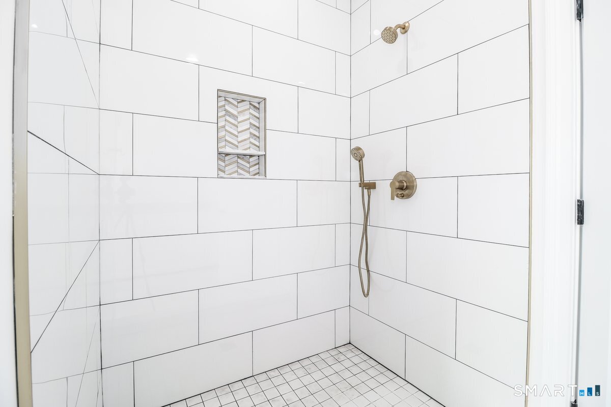 53 Pembroke Road Danbury, CT 06811 - Photo 29 of 37 a bathroom with a shower