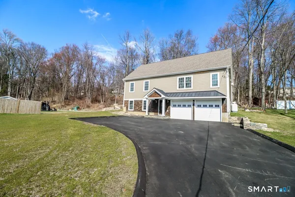 front view of a house with a yard