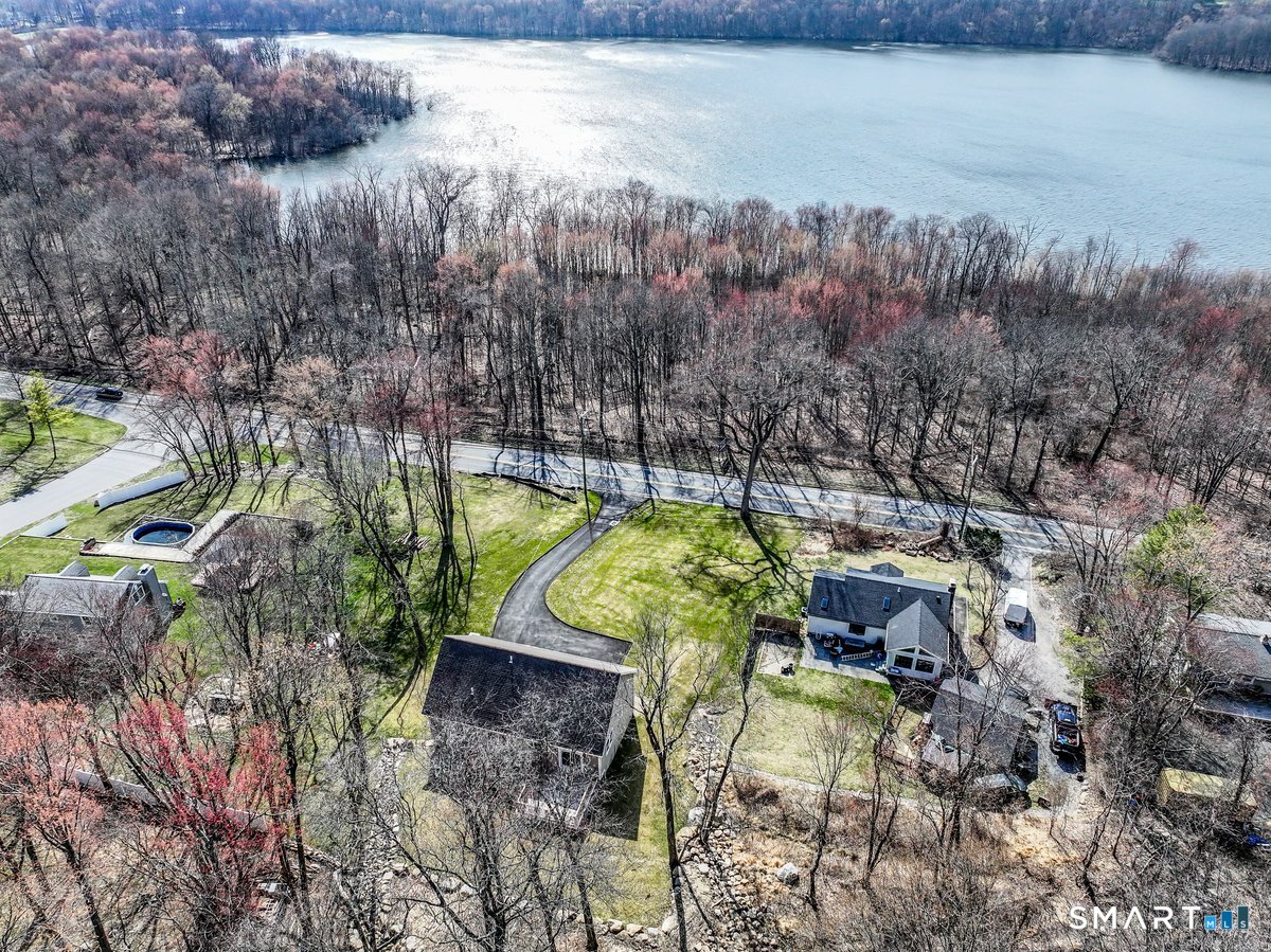 53 Pembroke Road Danbury, CT 06811 - Photo 5 of 37 a view of yard along with trees