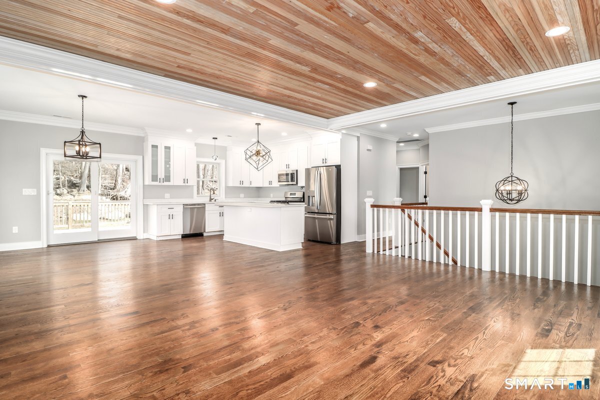 53 Pembroke Road Danbury, CT 06811 - Photo 9 of 37 a view of a kitchen with furniture and wooden floor