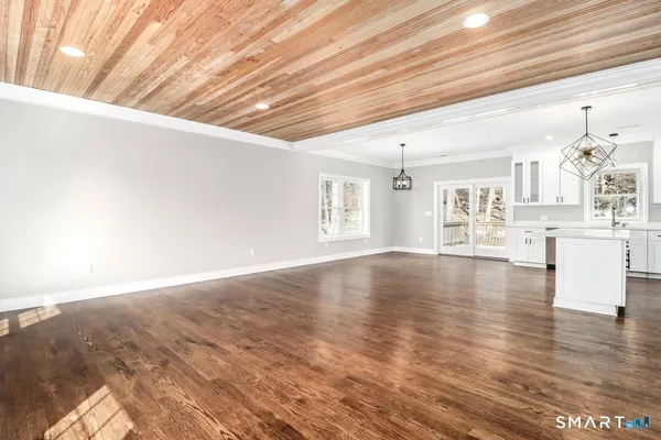a view of a livingroom with wooden floor