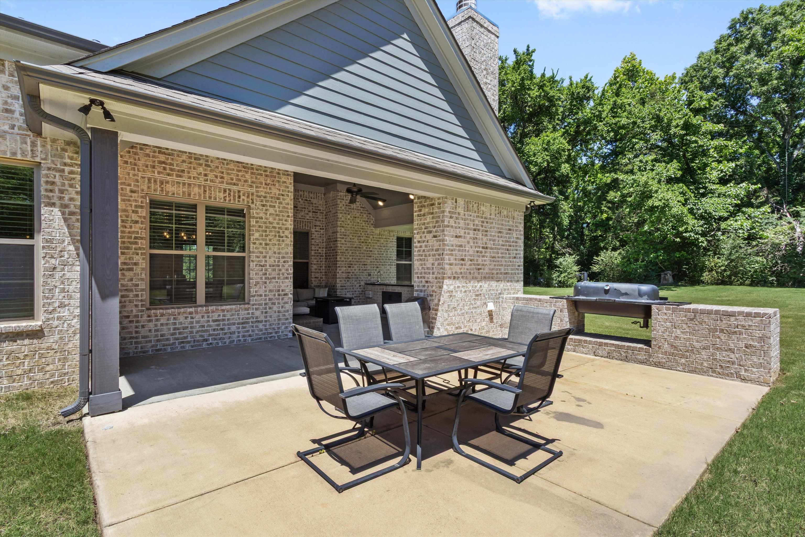 65 Watson Road Oakland, TN 38060 - Photo 34 of 40 a view of a patio with a table and chairs