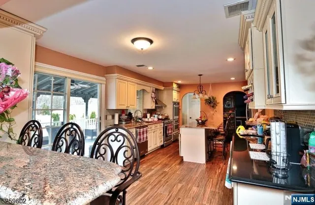 a view of a kitchen and dining room