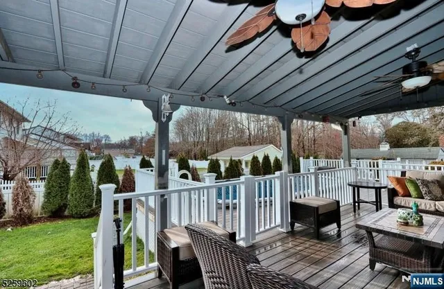 a view of a deck with furniture