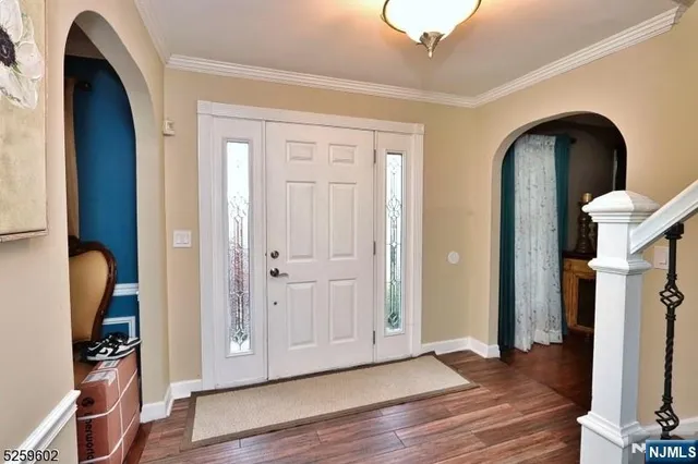 a view of entryway with wooden floor