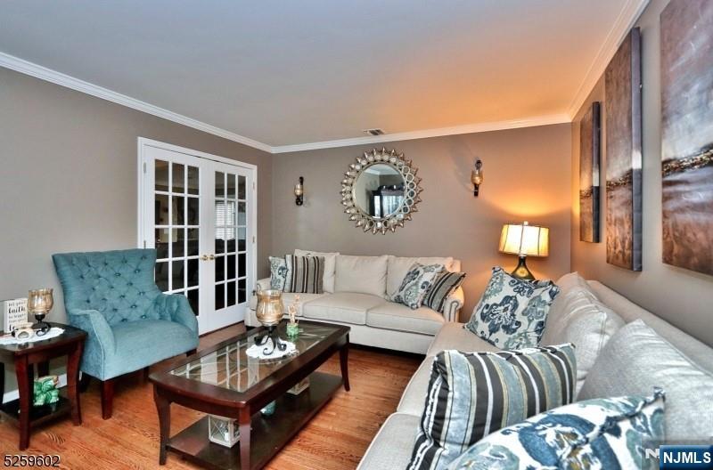 8 Winfield Court Fairfield, NJ 07004 - Photo 5 of 16 a living room with furniture and a potted plant