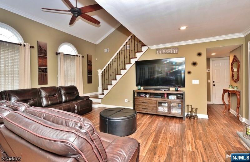 8 Winfield Court Fairfield, NJ 07004 - Photo 8 of 16 a living room with furniture and a flat screen tv