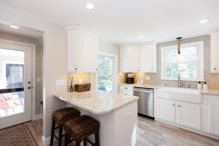 11 Cotuit Cove Road Cotuit, MA 02635 - Photo 11 of 35 a kitchen with a stove a sink and a refrigerator