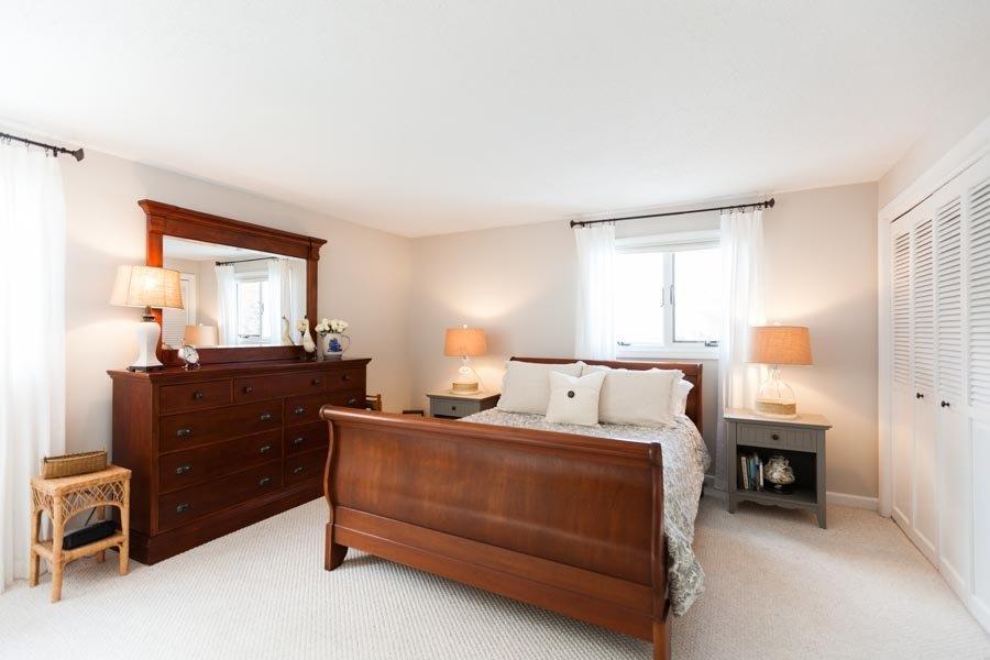 11 Cotuit Cove Road Cotuit, MA 02635 - Photo 12 of 35 a bed room with a bed and a window
