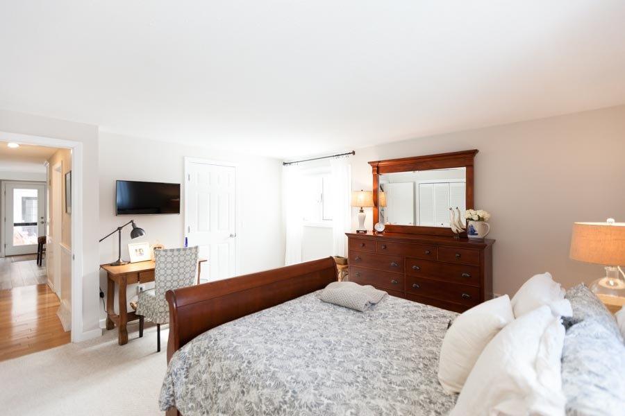 11 Cotuit Cove Road Cotuit, MA 02635 - Photo 13 of 35 a bedroom with a bed and a flat screen tv