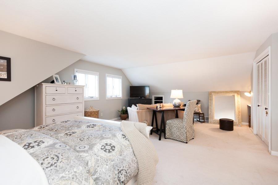 11 Cotuit Cove Road Cotuit, MA 02635 - Photo 21 of 35 a bedroom with a bed and a couch