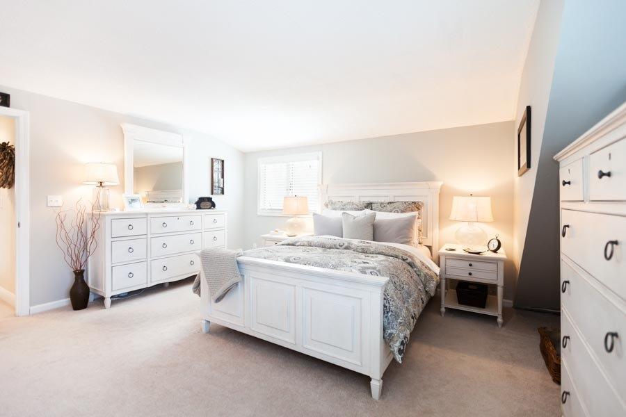 11 Cotuit Cove Road Cotuit, MA 02635 - Photo 22 of 35 a room with a bed and a cabinets