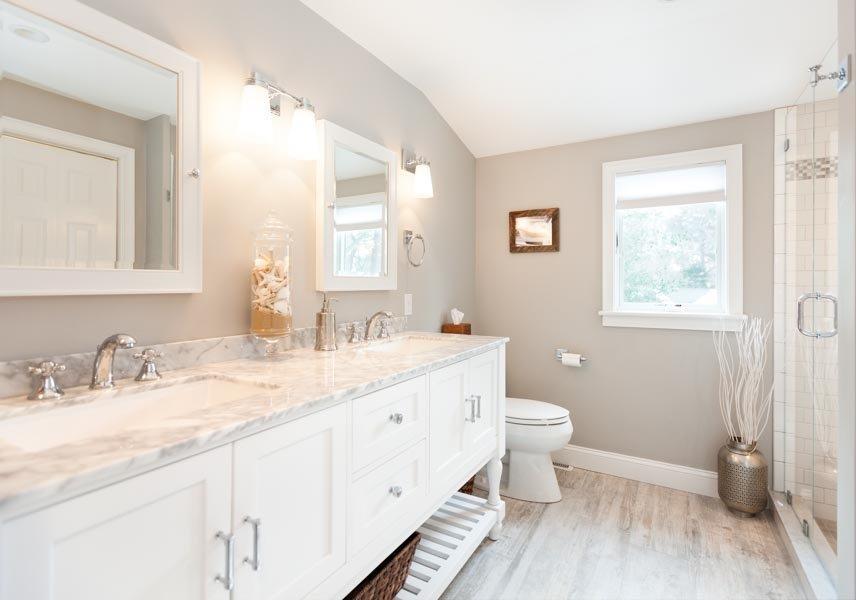 11 Cotuit Cove Road Cotuit, MA 02635 - Photo 23 of 35 a bathroom with a granite countertop sink mirror and a toilet