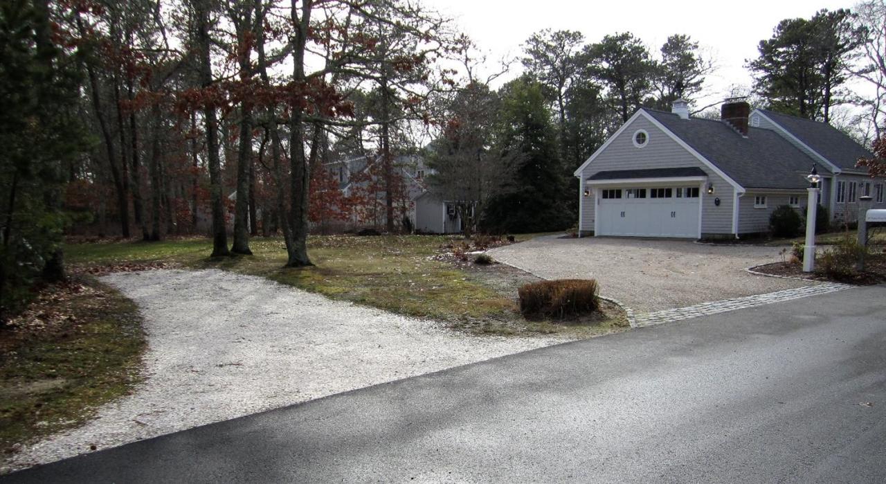 11 Cotuit Cove Road Cotuit, MA 02635 - Photo 35 of 35 a house with trees in the background
