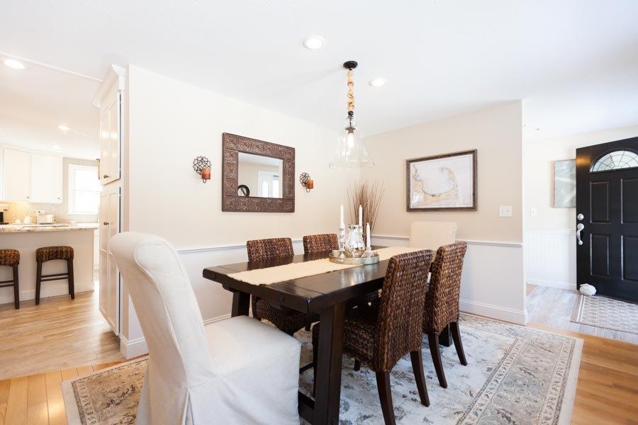 11 Cotuit Cove Road Cotuit, MA 02635 - Photo 4 of 35 a view of a dining room with furniture