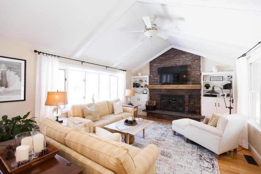 11 Cotuit Cove Road Cotuit, MA 02635 - Photo 6 of 35 a living room with furniture a fireplace and a flat screen tv