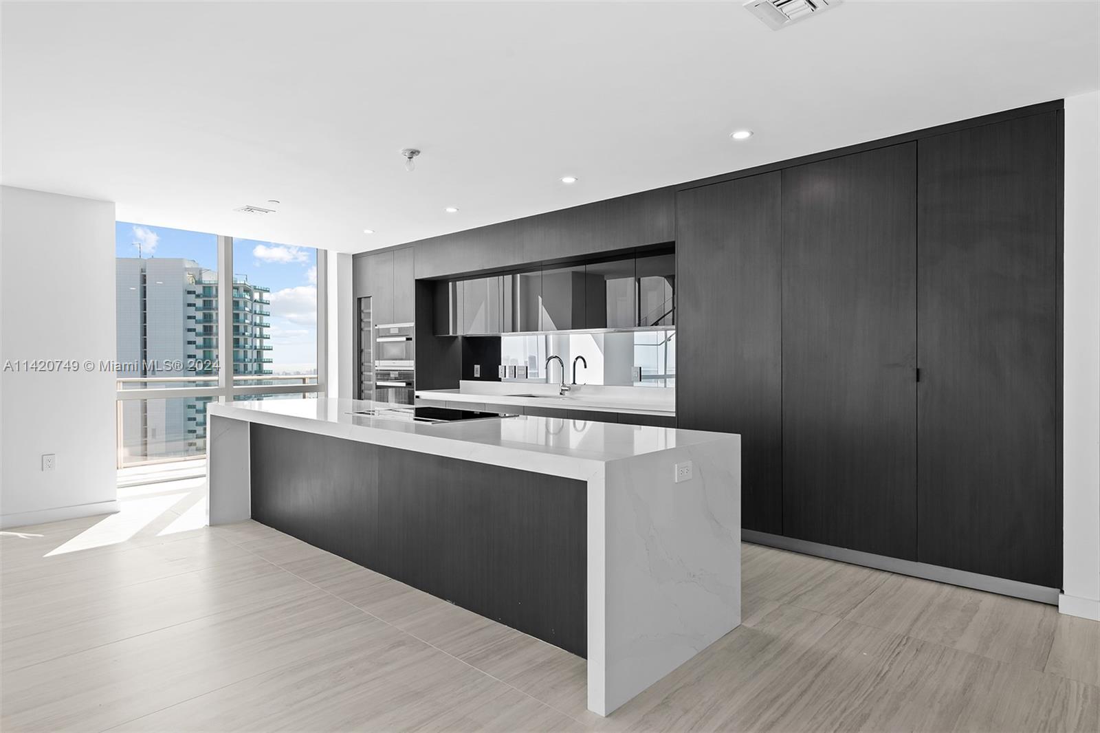 Park West Miami, FL 33132 - Photo 17 of 88 a kitchen with stainless steel appliances a refrigerator and a stove top oven