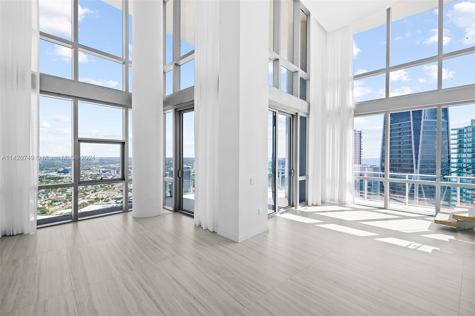 Park West Miami, FL 33132 - Photo 18 of 88 an empty room with wooden floor and windows