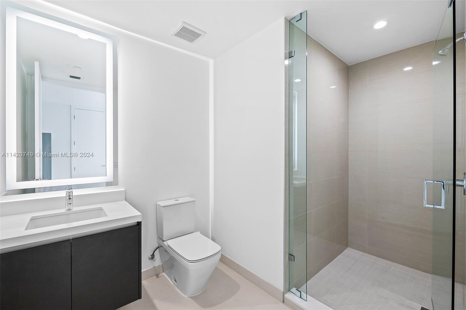 Park West Miami, FL 33132 - Photo 30 of 88 a bathroom with a sink a toilet and shower