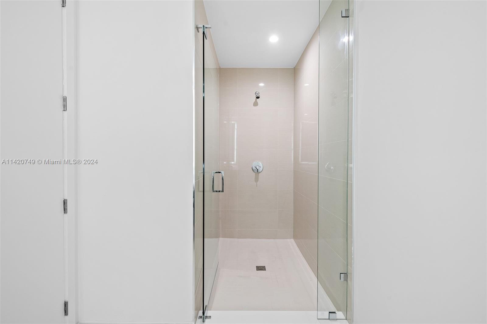 Park West Miami, FL 33132 - Photo 42 of 88 a bathroom with a glass shower door
