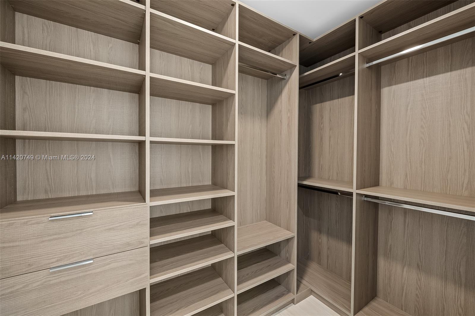 Park West Miami, FL 33132 - Photo 50 of 88 a view of walk in closet with empty racks