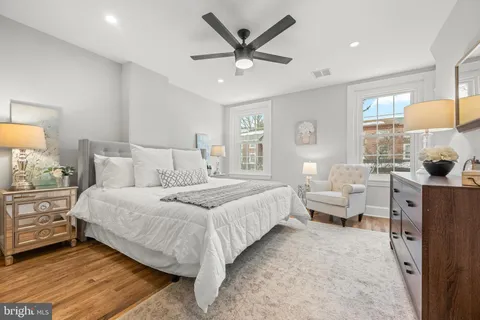 a spacious bedroom with a bed and window