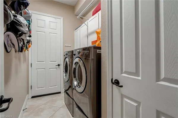 a utility room with dryer and washer