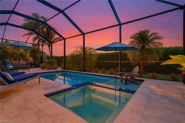 a view of a swimming pool with a lounge chairs
