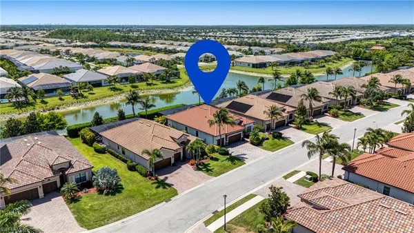 an aerial view of a house with a yard