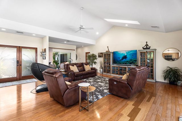 an aerial view of a house with a yard and garden