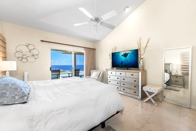 a bathroom with a granite countertop sink mirror and shower