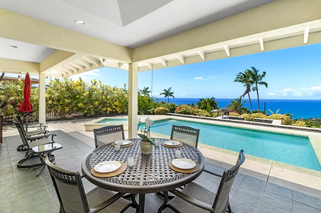 a view of a swimming pool and lounge chair
