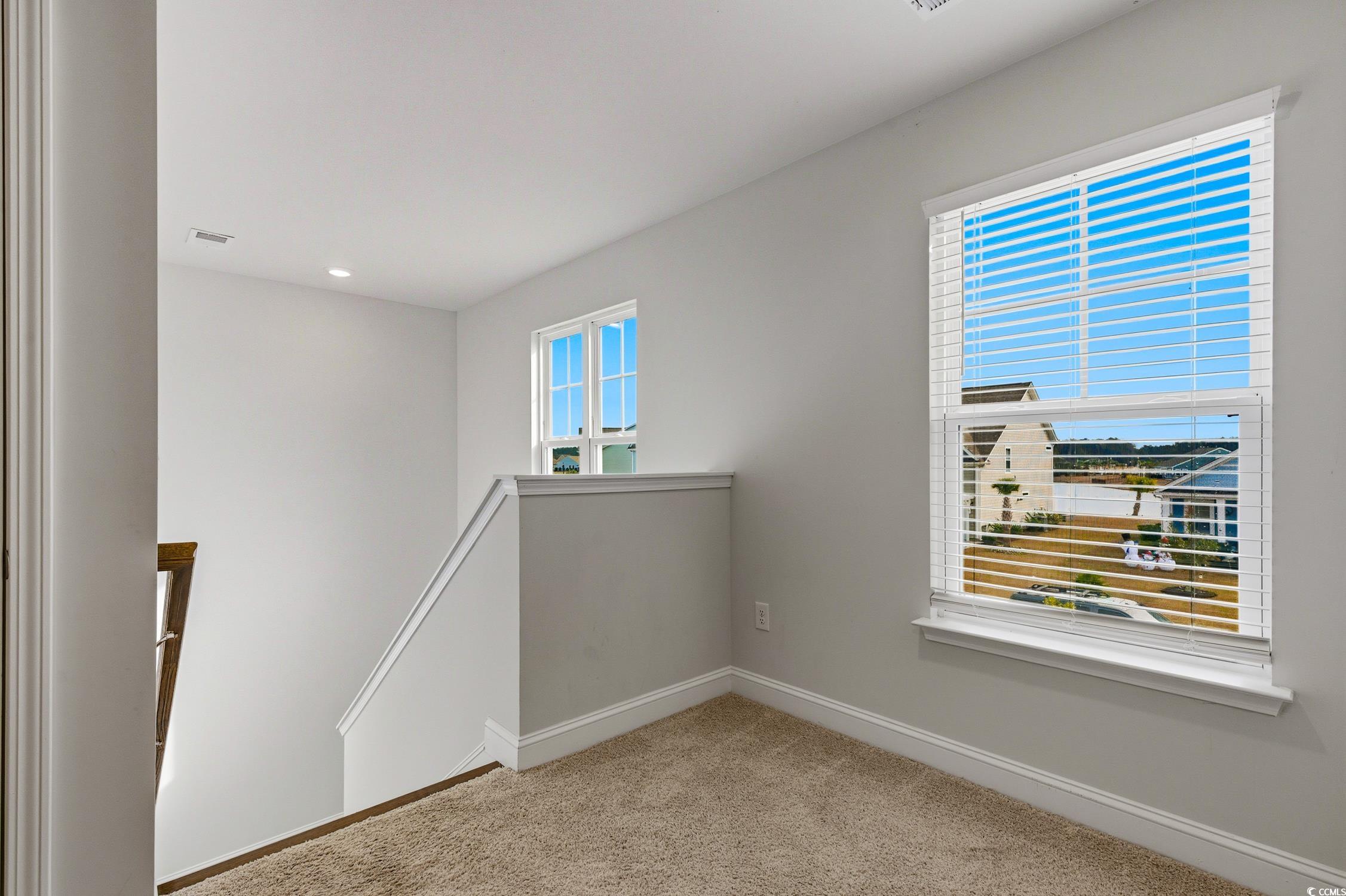 3083 Gillham Loop Myrtle Beach, SC 29588 - Photo 18 of 34 Stairs with wood finished floors and baseboards