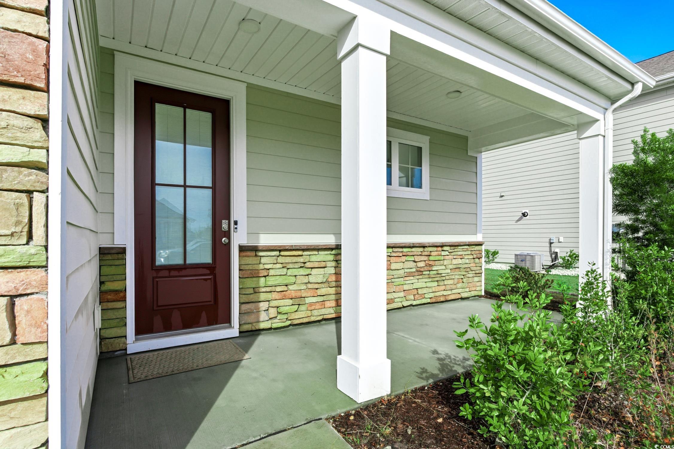 3083 Gillham Loop Myrtle Beach, SC 29588 - Photo 2 of 34 Doorway to property with a porch and stone siding