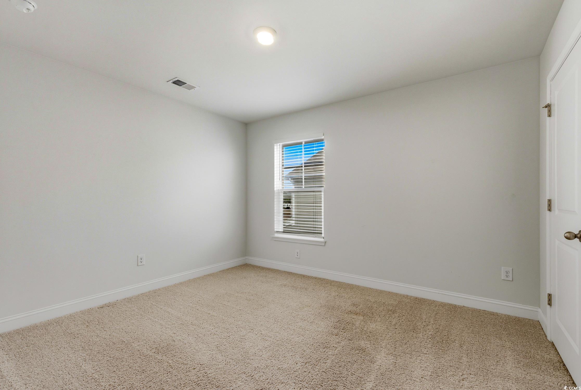 3083 Gillham Loop Myrtle Beach, SC 29588 - Photo 20 of 34 Spare room featuring light carpet and baseboards