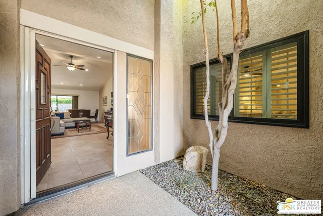 view of living room with furniture and a window